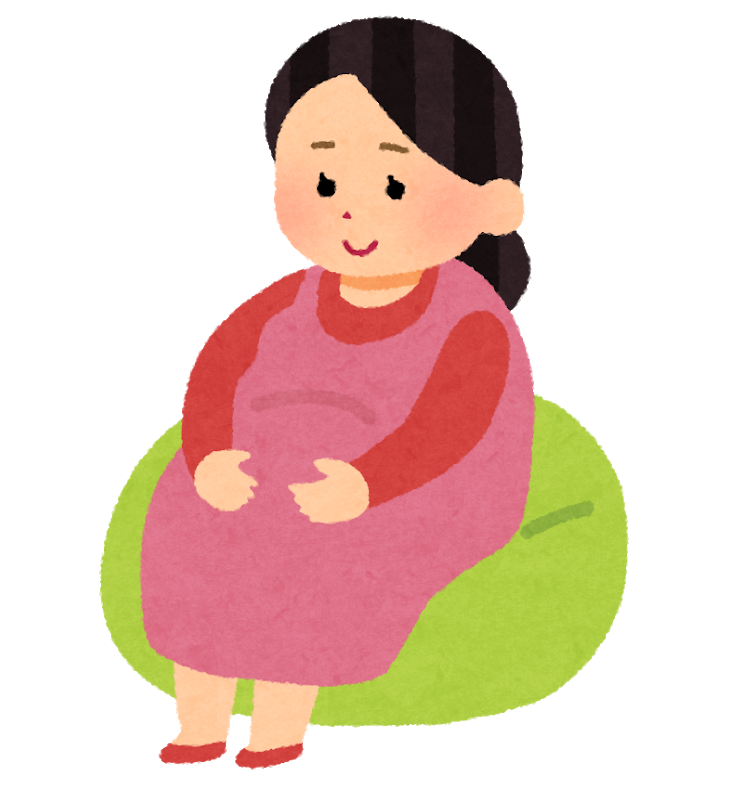 緑色のクッションに座っている妊婦さんのイラスト